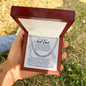 Cuban Link Chain with a message card for golf dad in a gift box in a man's hand